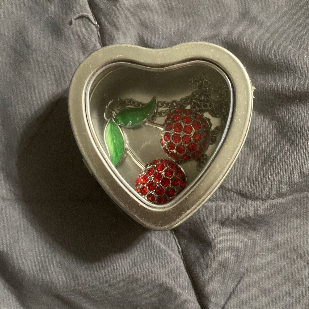 Cherry necklace in heart case , pair your items up with jeans , dresses, skirts